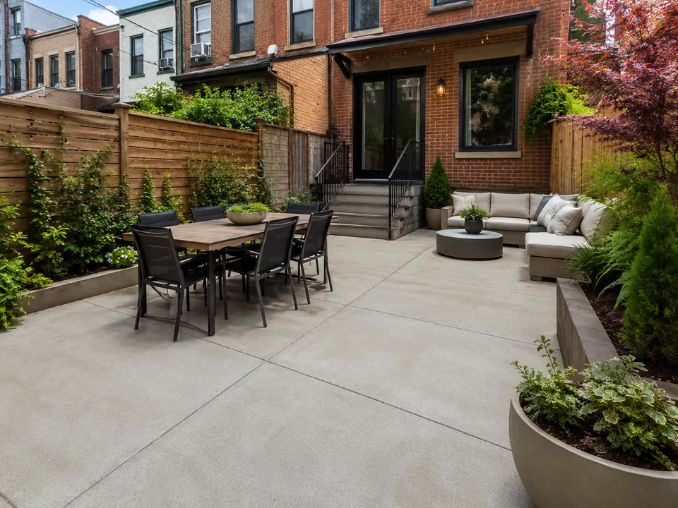 Finished concrete patio in a Bay Ridge Brooklyn residential backyard