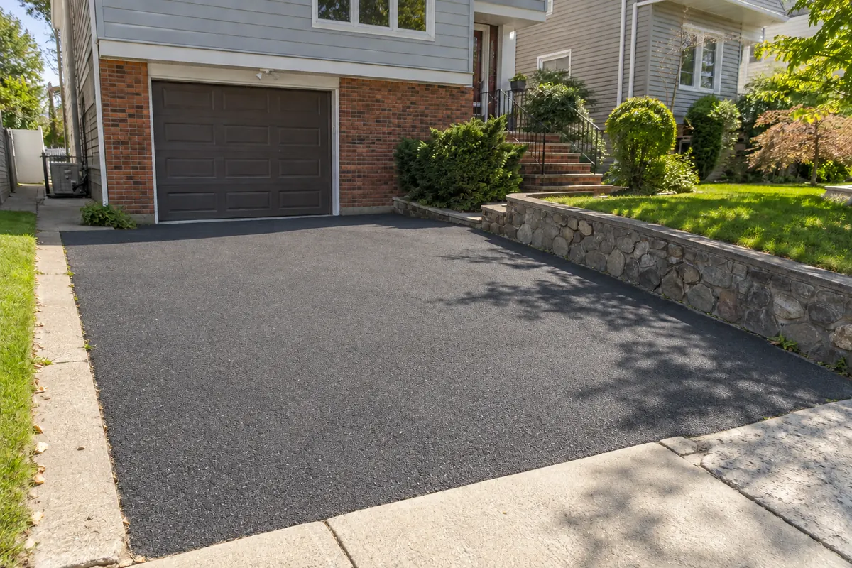 Restored driveway surface after professional repair at an NYC property
